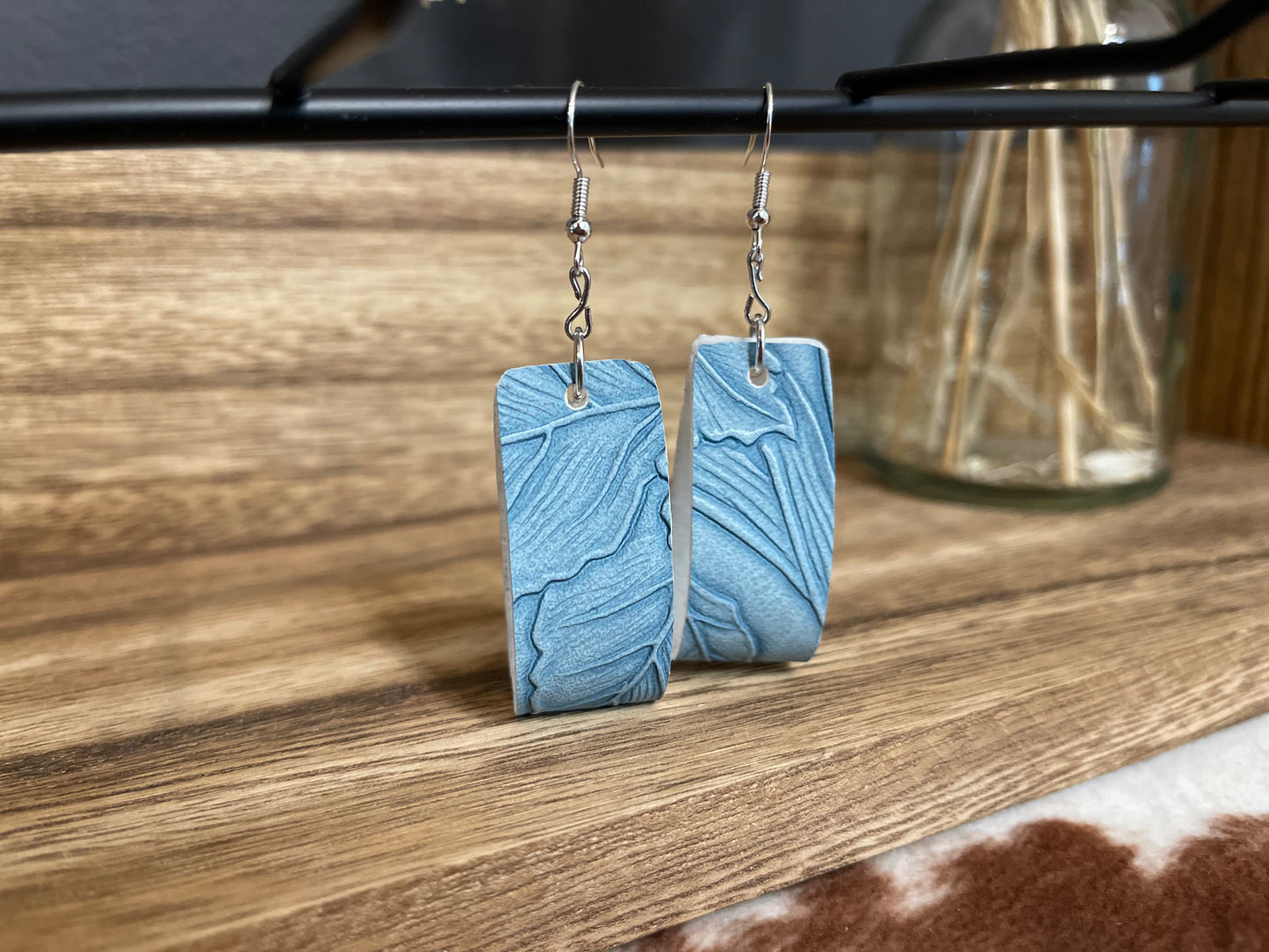 Medium baby blue faux leather earrings