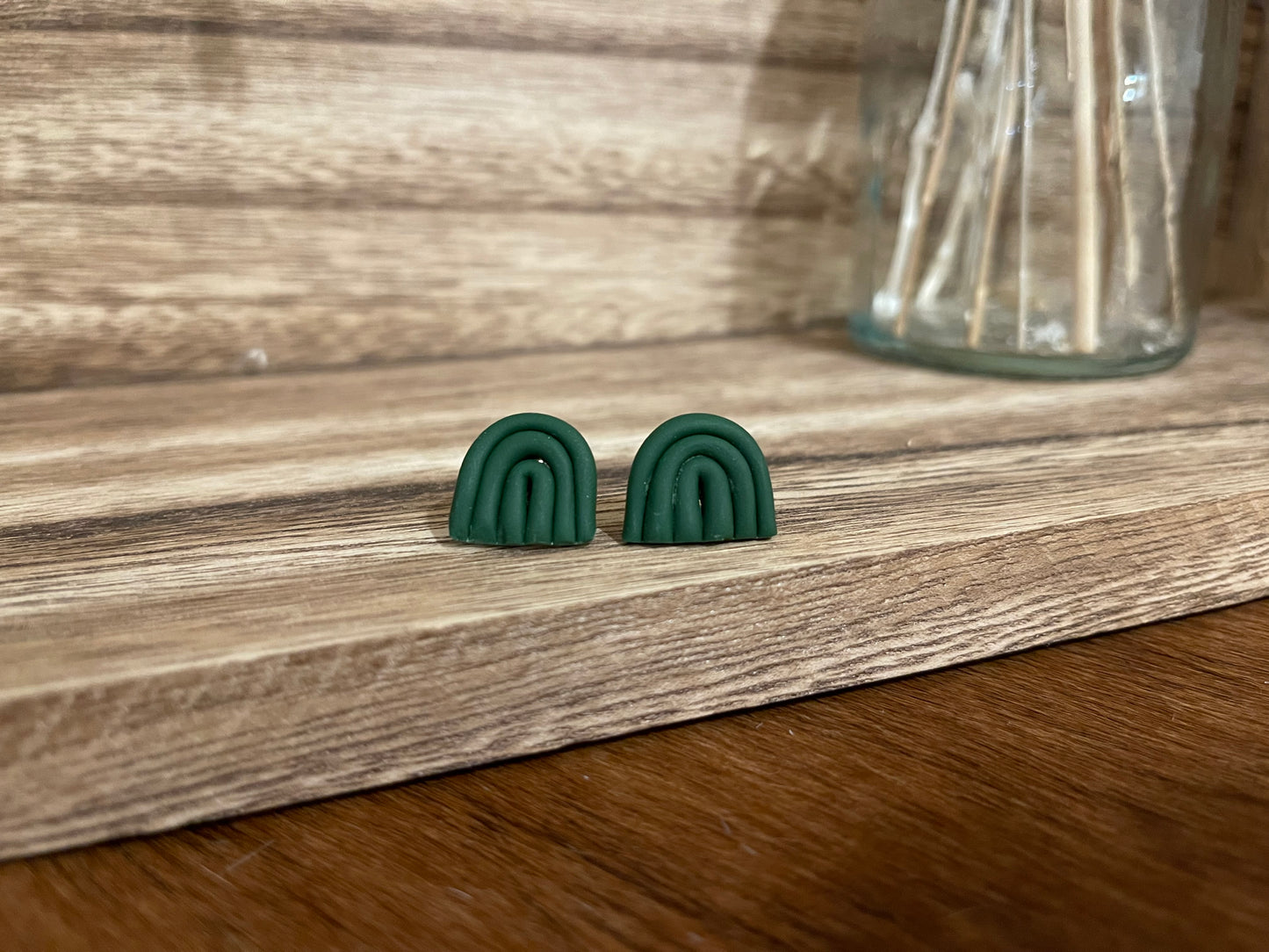 Dark green rainbow clay studs