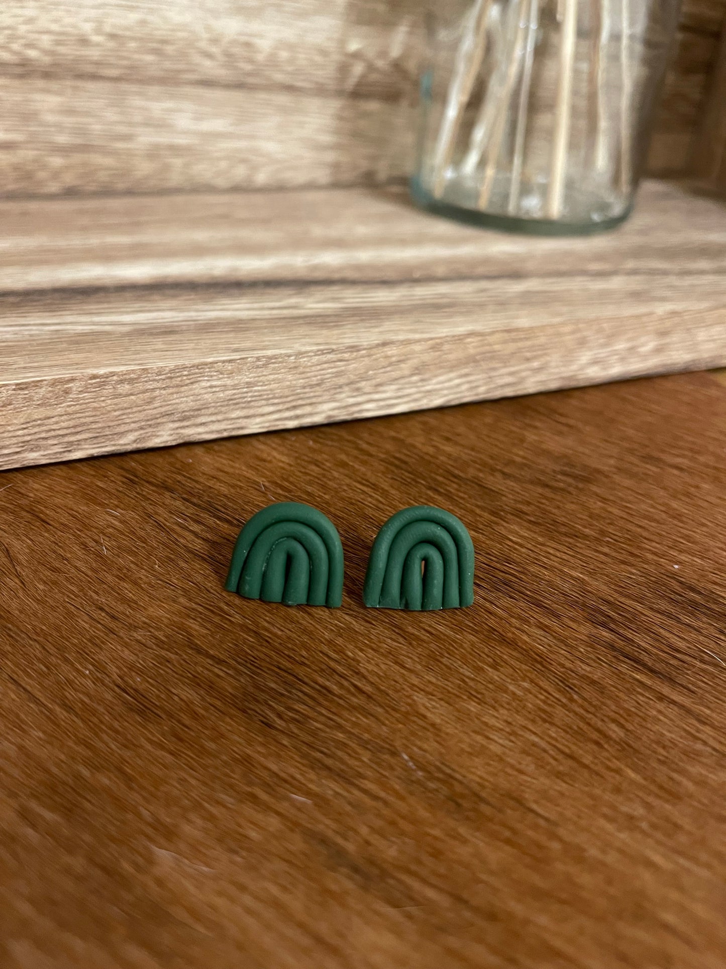 Dark green rainbow clay studs