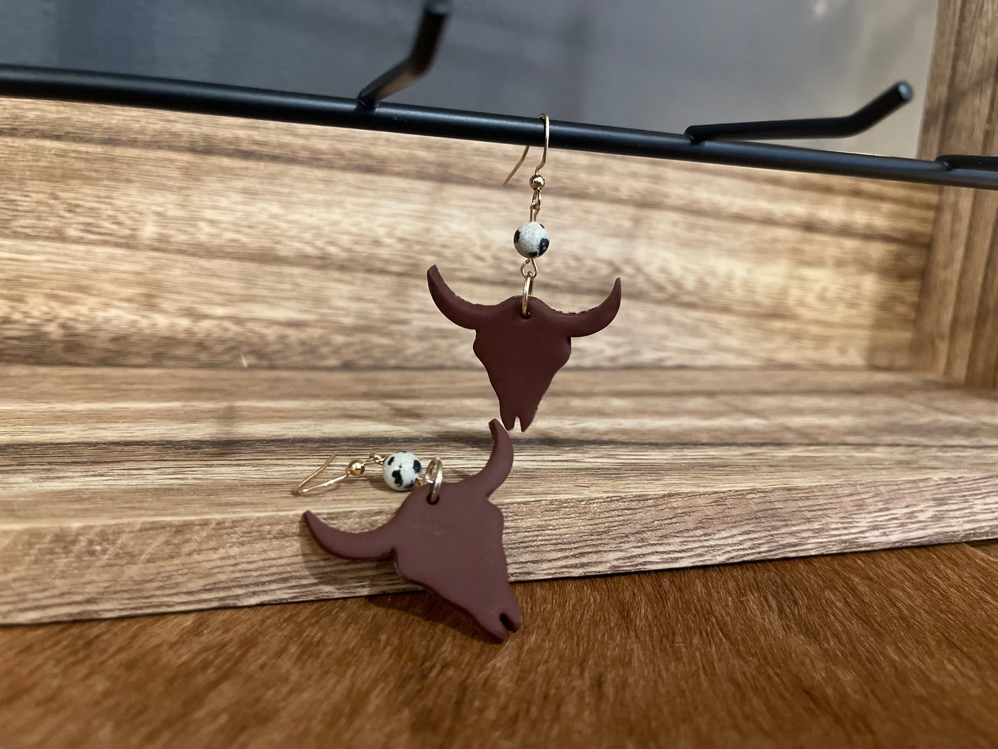 Brown cow skull clay drop earrings